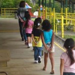 Kids marching in line at school.